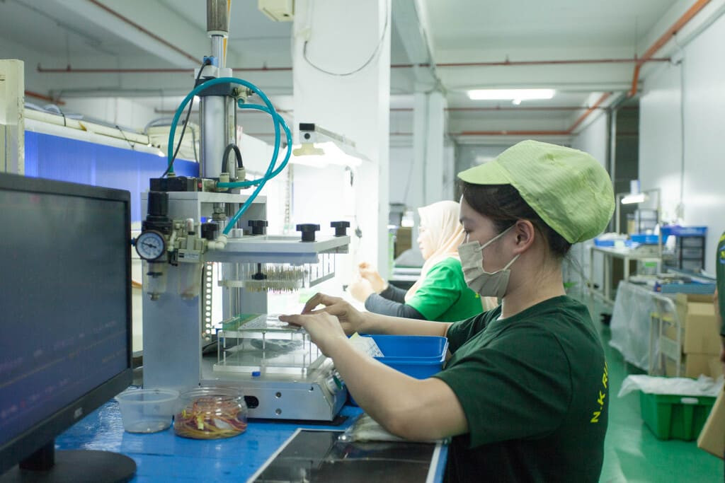 Industrial rubber manufacturing equipment and advanced machinery 15 at NK Rubber facility.