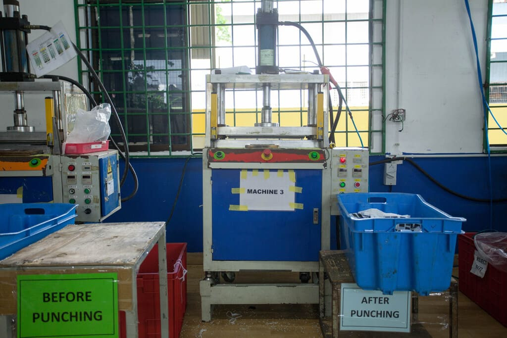 Industrial rubber manufacturing equipment and advanced machinery 18 at NK Rubber facility.